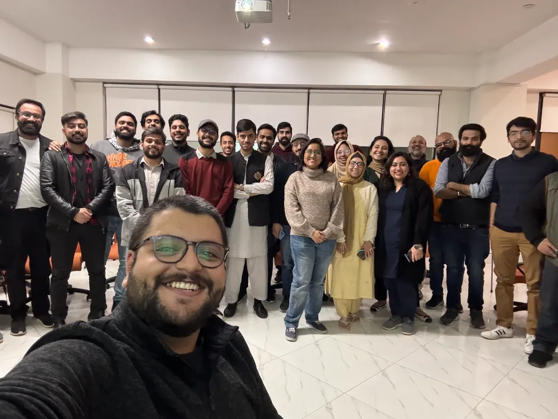 About twenty-five people together in a meeting room at the end of a Product Soch Islamabad session